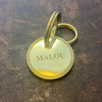 Dog sign in brass